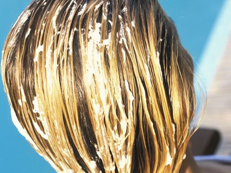 Woman having hair treatment